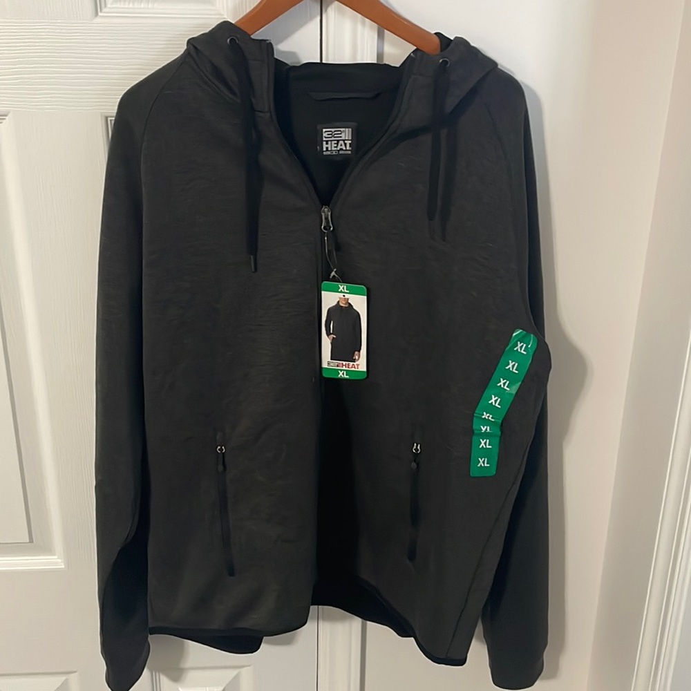 32 Heat zip up sweatshirt black 4 pockets. Two inside and two on outside. New